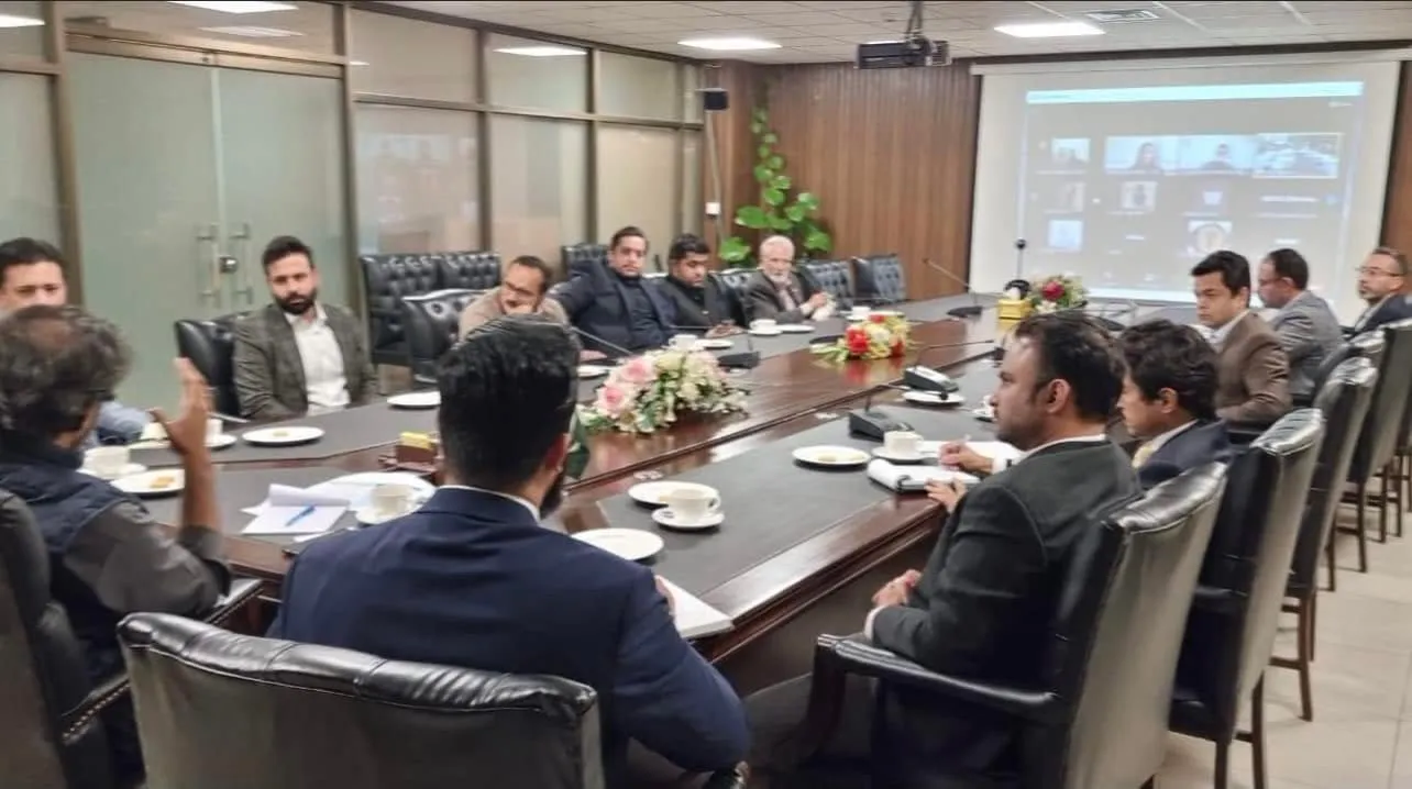 The e-commerce session at the Ministry of Commerce in Islamabad, with participants around a long table