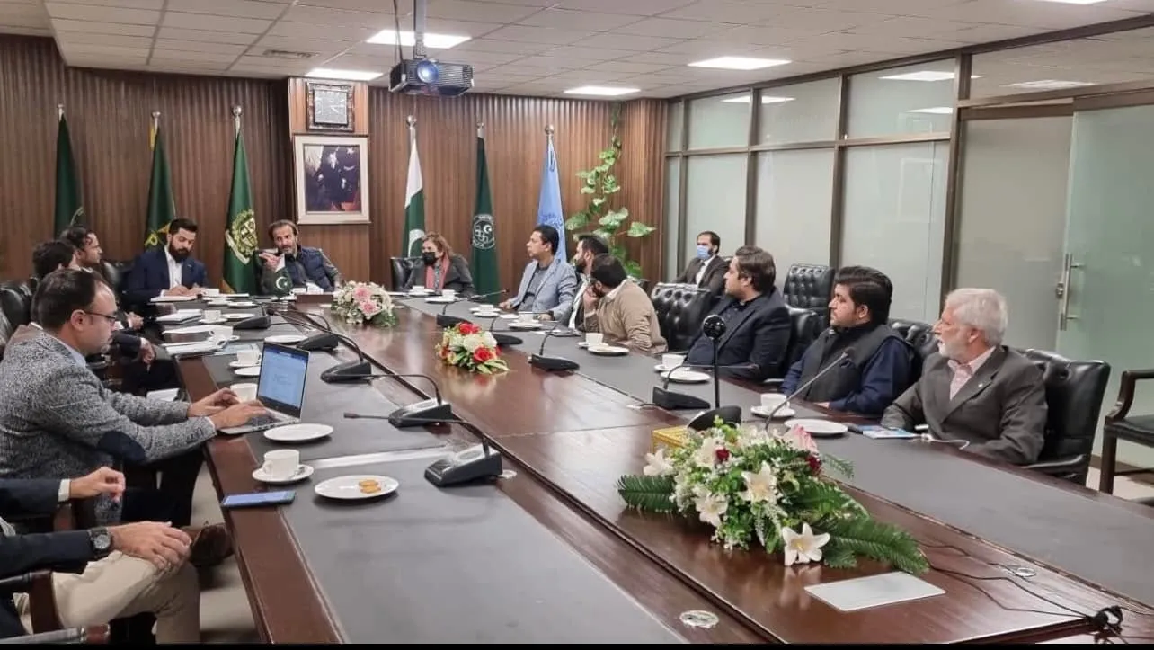 The long conference table at the Ministry of Commerce session