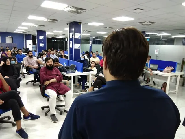 Attendees seated at desks during a training session